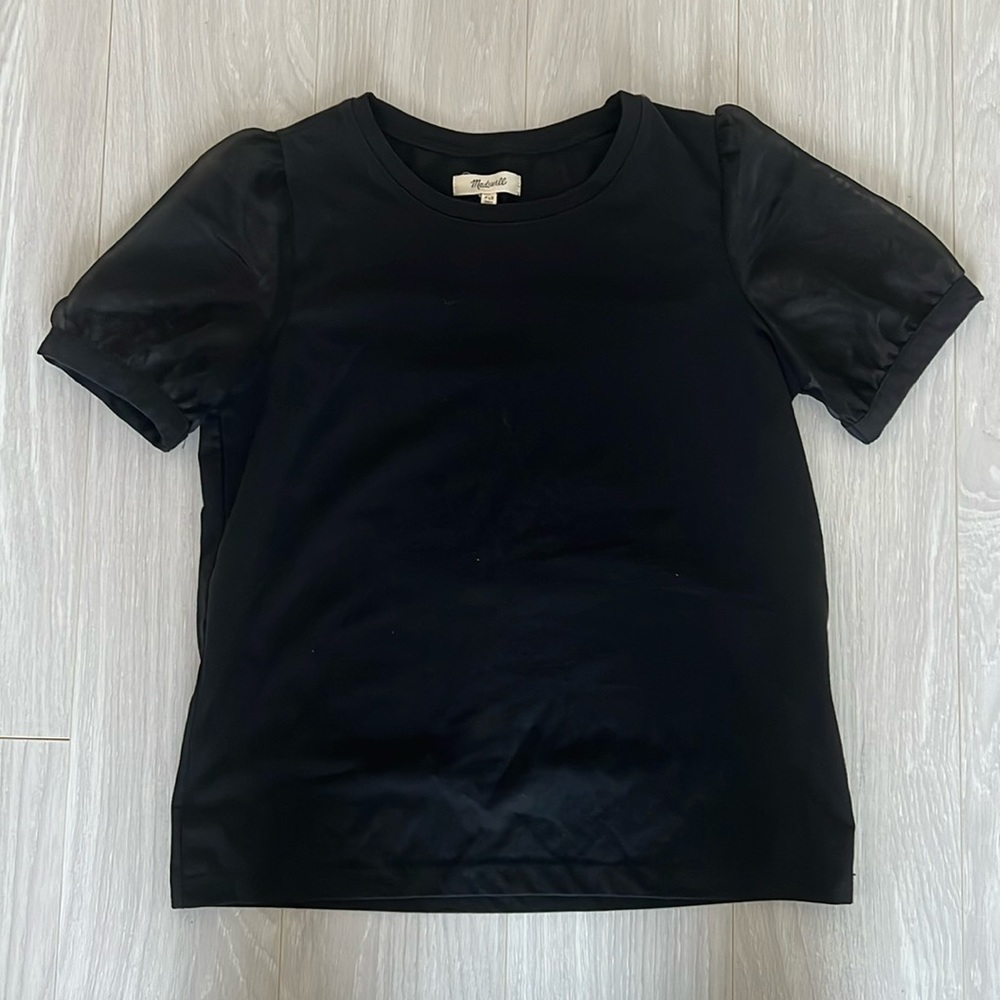 Adorable black t-shirt with sheer cap sleeves.